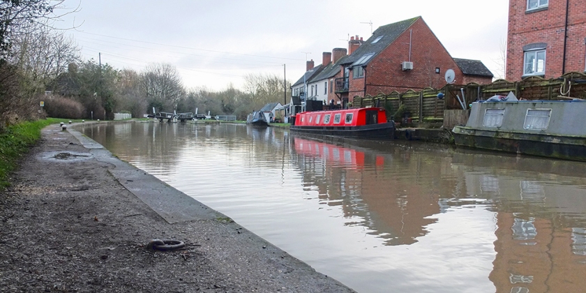 red canal boat moored on Grand Union Canal